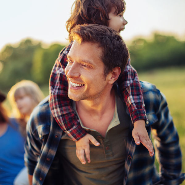 father and son smiling