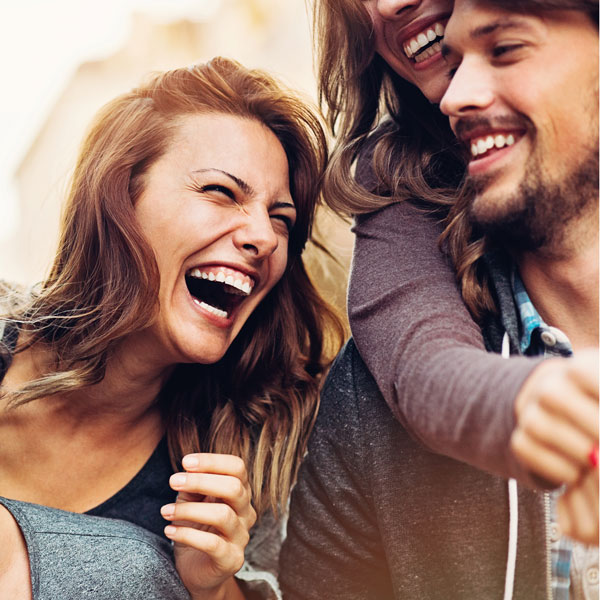 three friends laughing