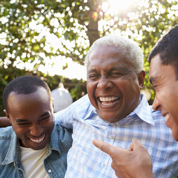 three men laughing together