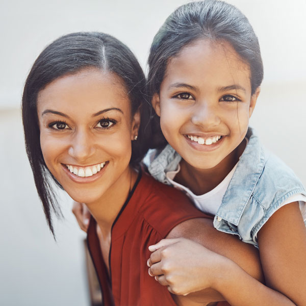 mother and daughter smiling